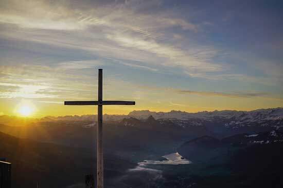 A cross set over a mountain range A cross set over a mountain range, highlighting how Jesus's sacrifice didn't abolish God's law, but instead empowers us to live by it.