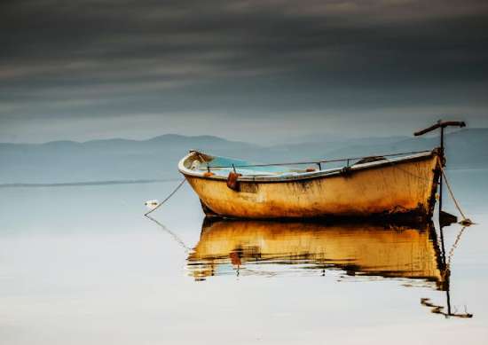 Fishing boat on lake A fishing boat on a lake, representing the kind of fishing boat the disciples might have used in first century Palestine