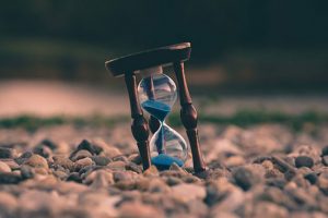 Hourglass  Hourglass on ground as we learn how God's timing is not our timing and we must wait upon Him and put our faith on His timing.