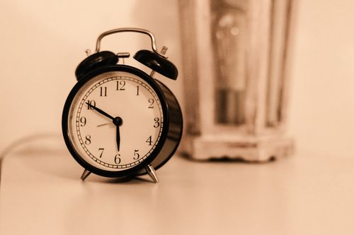An alarm clock on a bedside table.