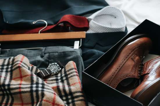 Men's Dress Clothing Laid Out Choosing what to wear applies to both women and men. You might see a guy's drawers filled with an abundance of pants, suits, watches, neckties, and shoes!