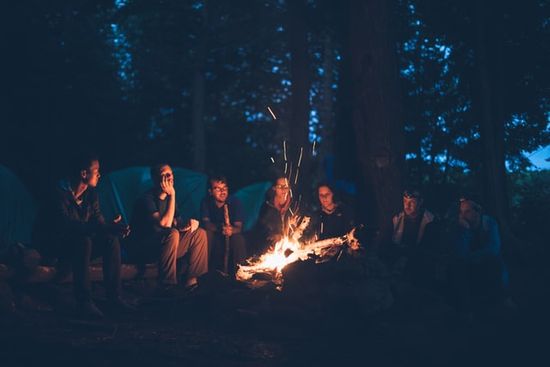 People sitting around the campfire People sitting around a a campfire telling stories, just as Jesus told parables to teach lessons