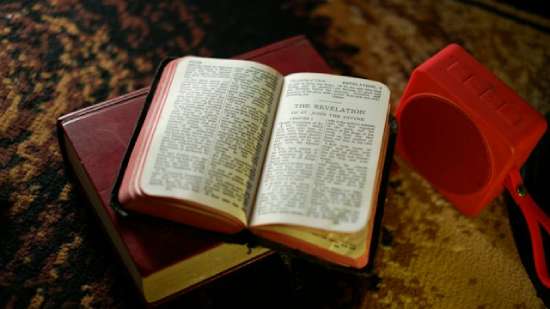 Bible open to the book of Revelation A Bible opened to the book of Revelation
