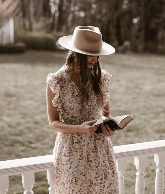 Modest Woman A modest woman reading a Bible