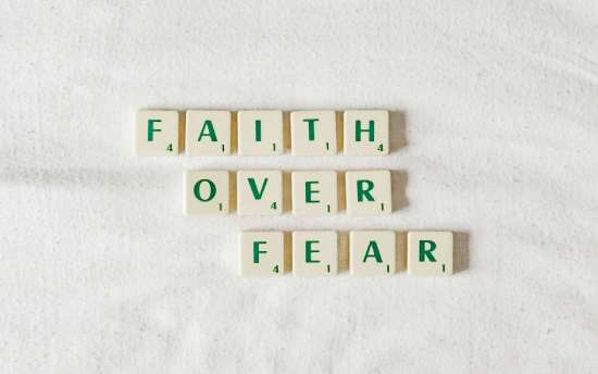 Faith over fear Word game pieces arranged to say