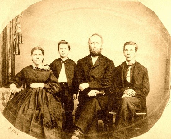A family portrait of Ellen White with her husband and two sons